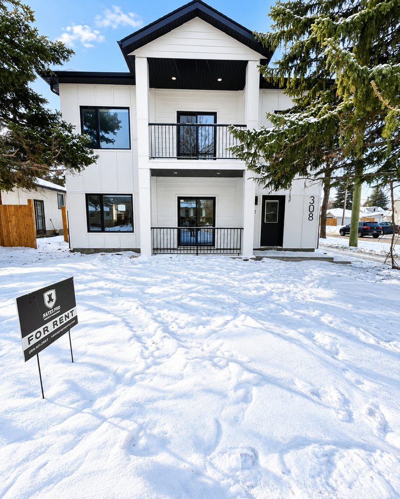 A Nate’s Pro managed four-plex rental property with a For Rent yard sign, North Kildonan