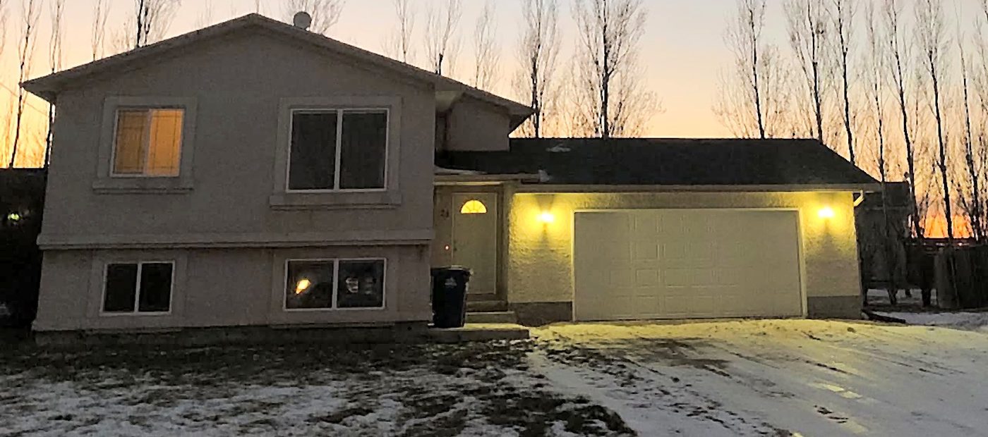 A Nate’s Pro managed rental property exterior, cleared and well lit in winter